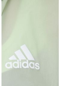 adidas Performance wiatrówka Back to Sport H48581 kolor fioletowy przejściowa oversize. Typ kołnierza: kaptur. Kolor: fioletowy. Materiał: materiał. Długość: krótkie. Styl: sportowy