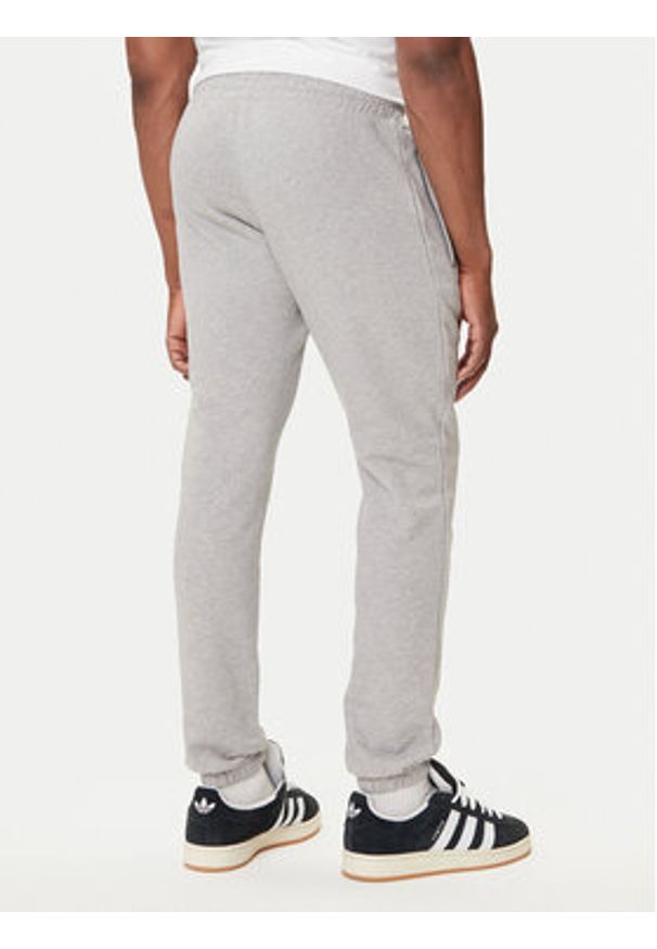 Adidas - adidas Spodnie dresowe Trefoil Essentials JY6271 Szary Slim Fit. Kolor: szary. Materiał: bawełna