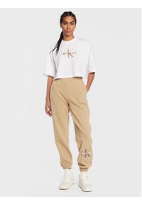 Calvin Klein Jeans Spodnie dresowe J20J220265 Beżowy Relaxed Fit. Kolor: beżowy. Materiał: dresówka, bawełna