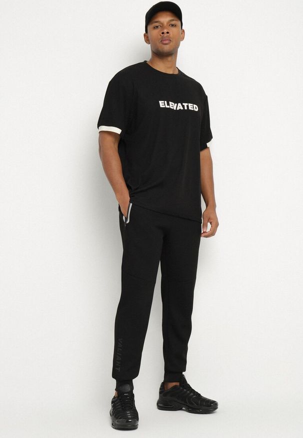 Born2be - Czarne Spodnie Dresowe z Gumą w Pasie z Kieszeniami na Suwaki Lilsedi. Okazja: na co dzień. Kolor: czarny. Materiał: dresówka, guma. Styl: klasyczny, casual