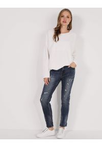 Unisono - JEANSY Z PRZETARCIAMI. Materiał: jeans. Styl: klasyczny