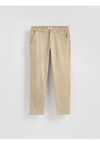Reserved - Spodnie chino slim fit - beżowy. Kolor: beżowy. Materiał: tkanina