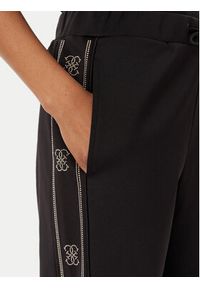 Guess Spodnie dresowe V5BB23 KCX22 Czarny Wide Leg. Kolor: czarny. Materiał: syntetyk #2
