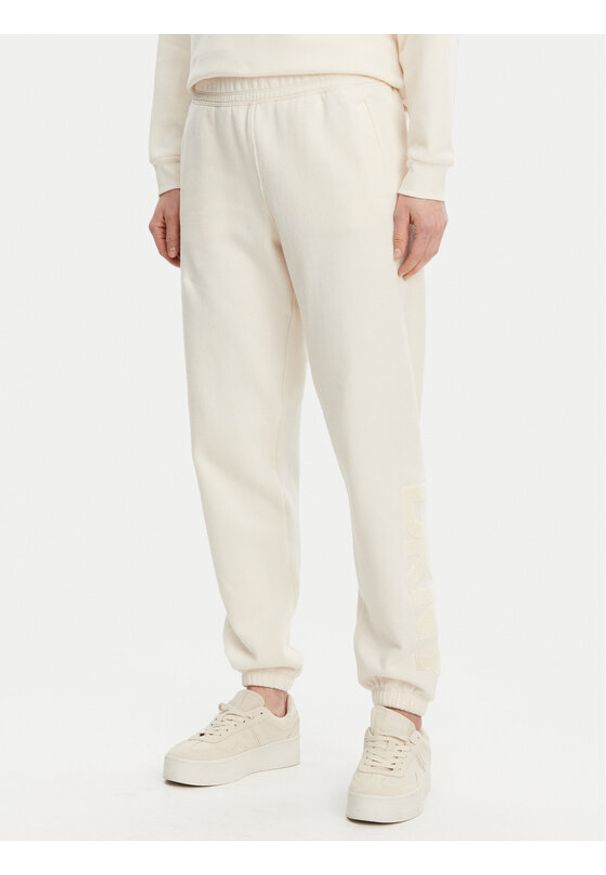 DKNY Sport Spodnie dresowe DP5P3585 Beżowy Regular Fit. Kolor: beżowy. Materiał: bawełna, syntetyk