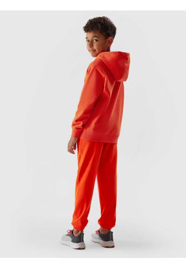 4f - Spodnie dresowe joggery chłopięce. Kolor: pomarańczowy. Materiał: dresówka. Wzór: napisy