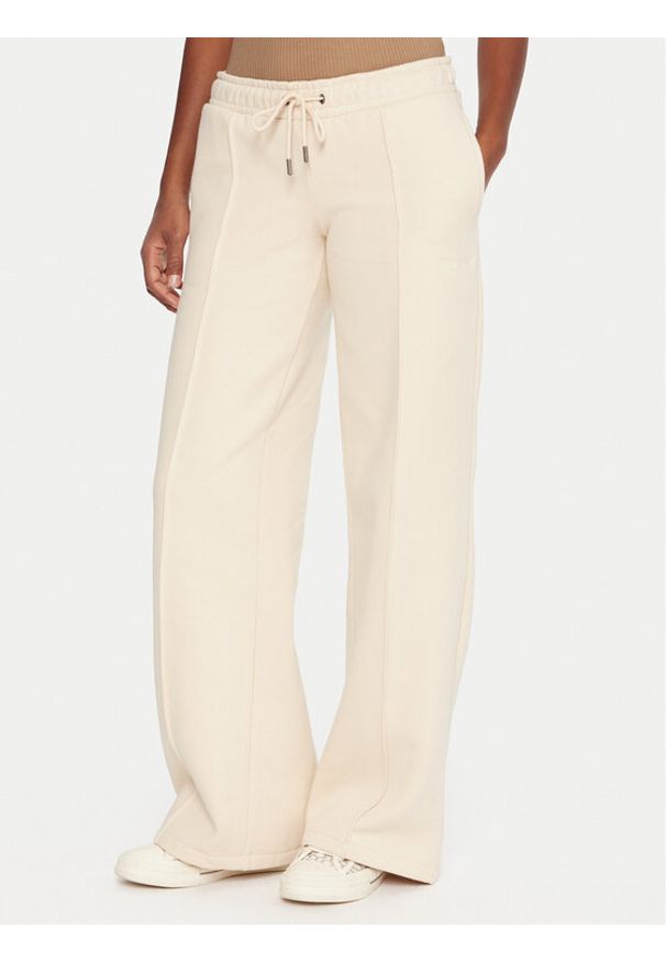 Guess Jeans Spodnie dresowe W5BB04 KC811 Beżowy Wide Leg. Kolor: beżowy. Materiał: bawełna