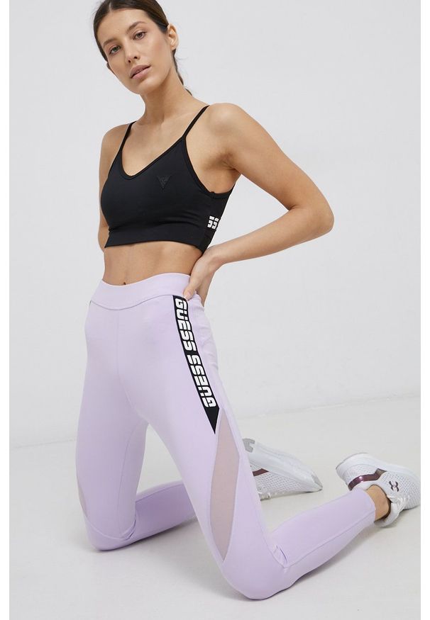 Guess - Legginsy. Kolor: fioletowy. Materiał: skóra, dzianina. Wzór: nadruk