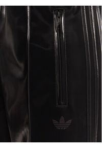 Adidas - adidas Spodnie dresowe adicolor Holiday JV7503 Czarny Loose Fit. Kolor: czarny. Materiał: wiskoza #4