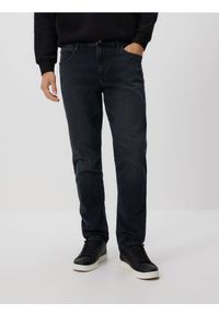 Reserved - Jeansy slim fit z efektem sprania - granatowy. Kolor: niebieski