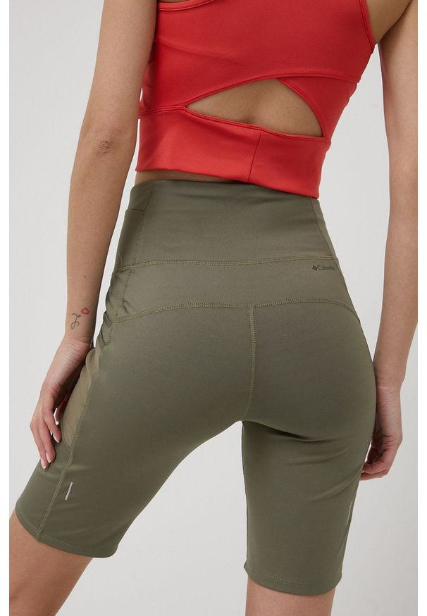 columbia - Columbia szorty sportowe Windgates damskie kolor zielony gładkie high waist. Stan: podwyższony. Kolor: zielony. Materiał: włókno, skóra, dzianina, materiał. Wzór: gładki. Styl: sportowy