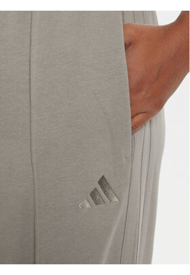 Adidas - adidas Dres Energize JX0535 Zielony Regular Fit. Kolor: zielony. Materiał: bawełna