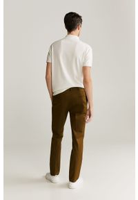 Mango Man - Spodnie Dublin. Kolor: brązowy. Materiał: tkanina, bawełna, materiał, elastan. Wzór: gładki #6