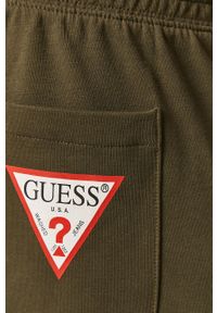Guess - Spodnie. Kolor: zielony. Materiał: dzianina. Wzór: gładki #4