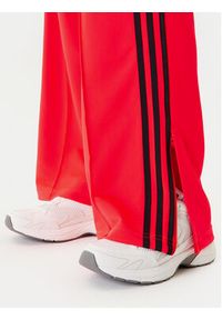 Adidas - adidas Spodnie dresowe adicolor Classic Firebird JW1227 Pomarańczowy Loose Fit. Kolor: pomarańczowy. Materiał: syntetyk #5