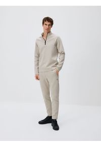 Reserved - Spodnie dresowe slim - jasnoszary. Kolor: szary. Materiał: dresówka