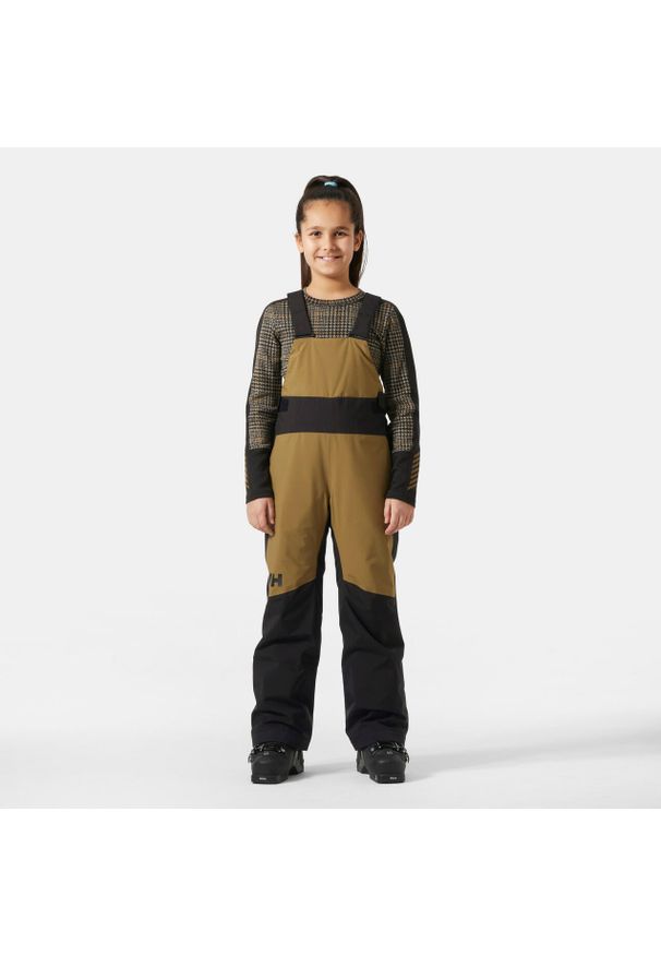 Dziewczęcy kombinezon narciarski Helly Hansen Stellar. Kolor: brązowy, beżowy, wielokolorowy. Sezon: zima. Sport: narciarstwo