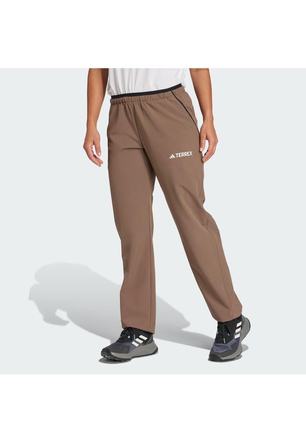 Adidas - Spodnie Terrex Multi Liteflex. Kolor: brązowy, beżowy, wielokolorowy. Materiał: materiał. Sezon: lato. Sport: turystyka piesza