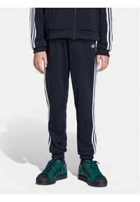 Adidas - adidas Spodnie dresowe adicolor SST KE2862 Czarny Regular Fit. Kolor: czarny. Materiał: syntetyk #1