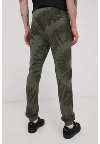 Ellesse Spodnie bawełniane męskie kolor zielony wzorzyste. Kolor: zielony. Materiał: bawełna