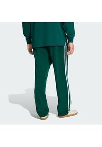Adidas - adidas Spodnie dresowe Firebird KD8317 Zielony Loose Fit. Kolor: zielony. Materiał: syntetyk #4