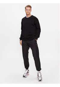 Reebok Spodnie dresowe Essentials II0695 Czarny Regular Fit. Kolor: czarny. Materiał: bawełna