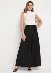 Born2be - Czarne Spodnie Typu Palazzo z Kwiatową Broszką Lirisse. Kolor: czarny. Wzór: kwiaty. Styl: elegancki #6