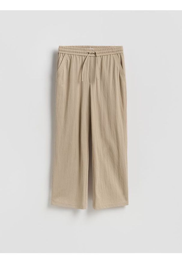 Reserved - Spodnie z wiązaniem - beżowy. Kolor: beżowy. Materiał: len, dzianina