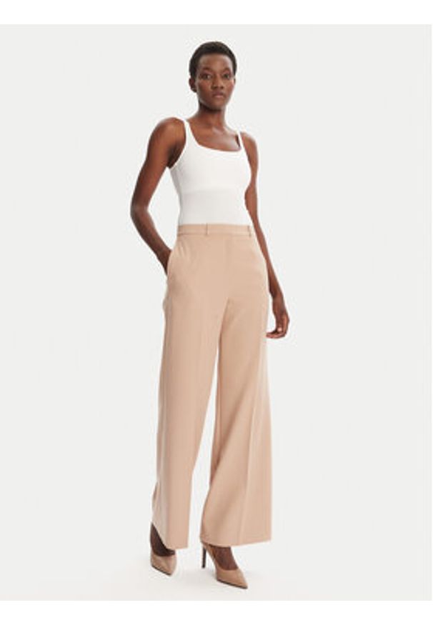 Hugo - HUGO Spodnie palazzo Hasmina 50545533 Beżowy Regular Fit. Kolor: beżowy. Materiał: syntetyk