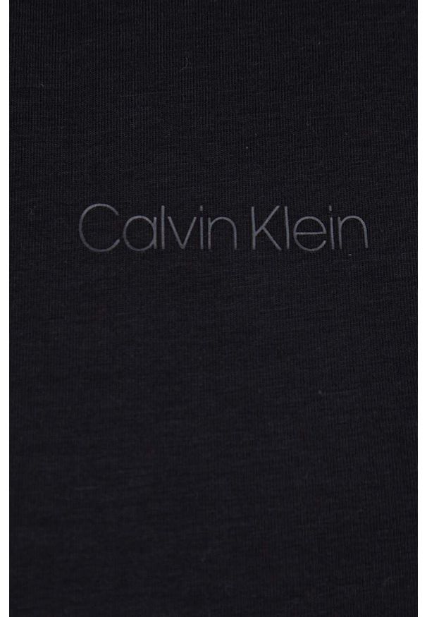 Calvin Klein Top damski kolor czarny z półgolfem. Typ kołnierza: golf. Kolor: czarny. Materiał: dzianina. Długość rękawa: na ramiączkach. Wzór: gładki