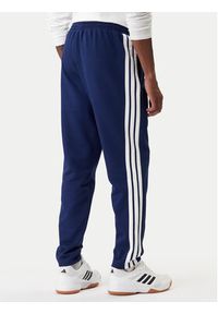 Adidas - adidas Spodnie dresowe Essentials 3-Stripes JE6334 Granatowy Regular Fit. Kolor: niebieski. Materiał: bawełna #5