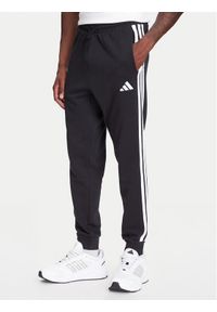 Adidas - adidas Spodnie dresowe Essential 3-Stripes JD1881 Czarny Regular Fit. Kolor: czarny. Materiał: bawełna