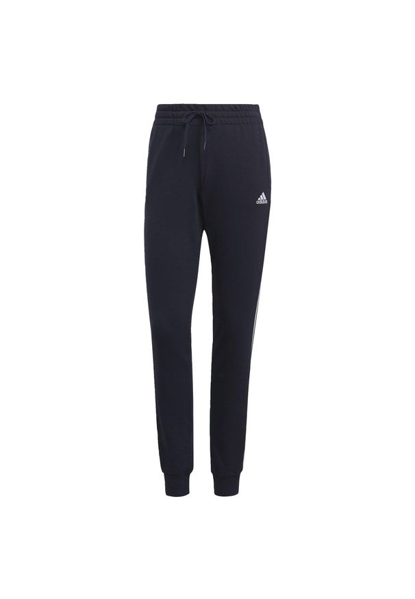 Adidas - Spodnie damskie adidas Essentials Slim Tapered Cuffed Pant. Kolor: biały, niebieski, wielokolorowy. Materiał: dresówka, materiał, bawełna. Długość: długie. Sport: fitness