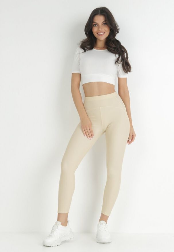 Born2be - Jasnobeżowe Legginsy Amarhiphae. Kolor: beżowy. Materiał: dzianina. Długość: długie. Wzór: aplikacja. Styl: sportowy