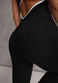 Renee - Czarny Kombinezon Sportowy Flare na Ramiączkach z Efektem Push Up i Lamówką Neamela. Okazja: na spacer. Kolor: czarny. Długość rękawa: na ramiączkach. Długość: krótkie. Styl: sportowy #3