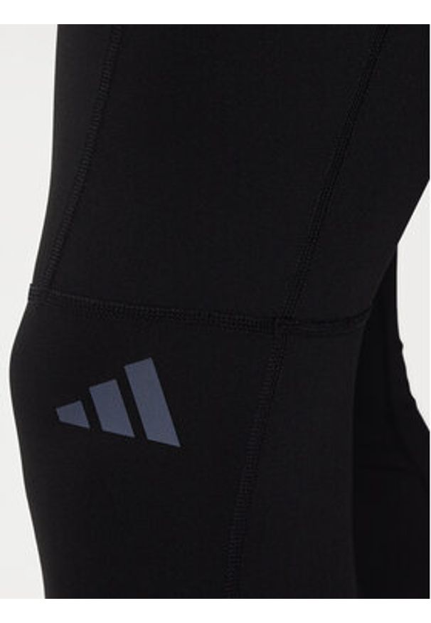 Adidas - adidas Legginsy Own The Run Winterized JN9597 Czarny Slim Fit. Kolor: czarny. Materiał: syntetyk. Sport: bieganie