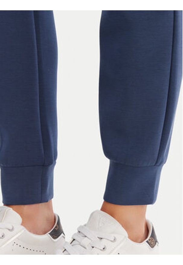 Guess Spodnie dresowe V4YB08 KCAY2 Granatowy Regular Fit. Kolor: niebieski. Materiał: syntetyk