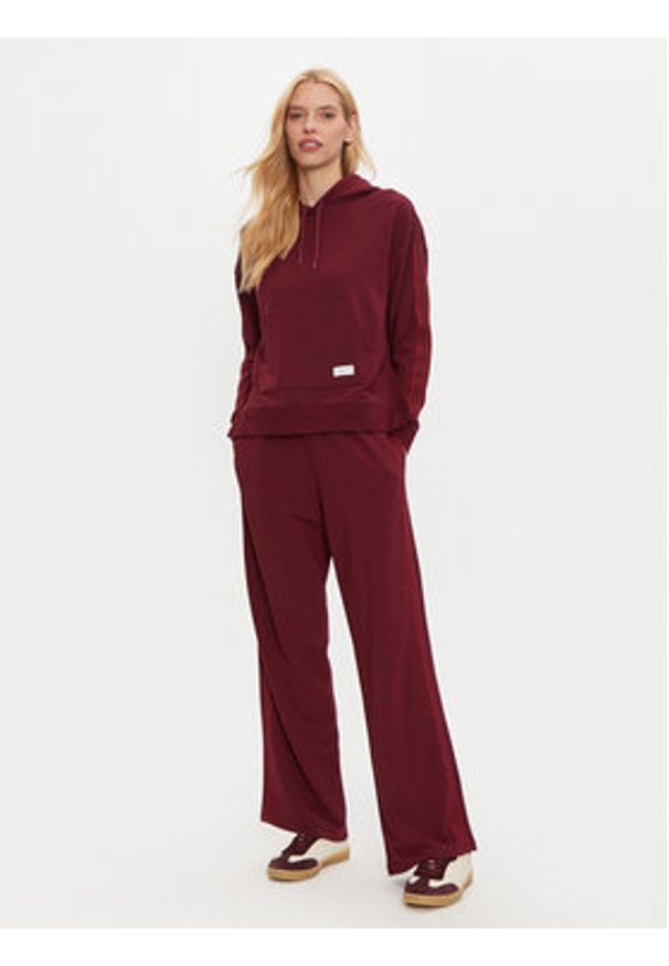 TOMMY HILFIGER - Tommy Hilfiger Spodnie dresowe UW0UW04771 Bordowy Relaxed Fit. Kolor: czerwony. Materiał: dresówka