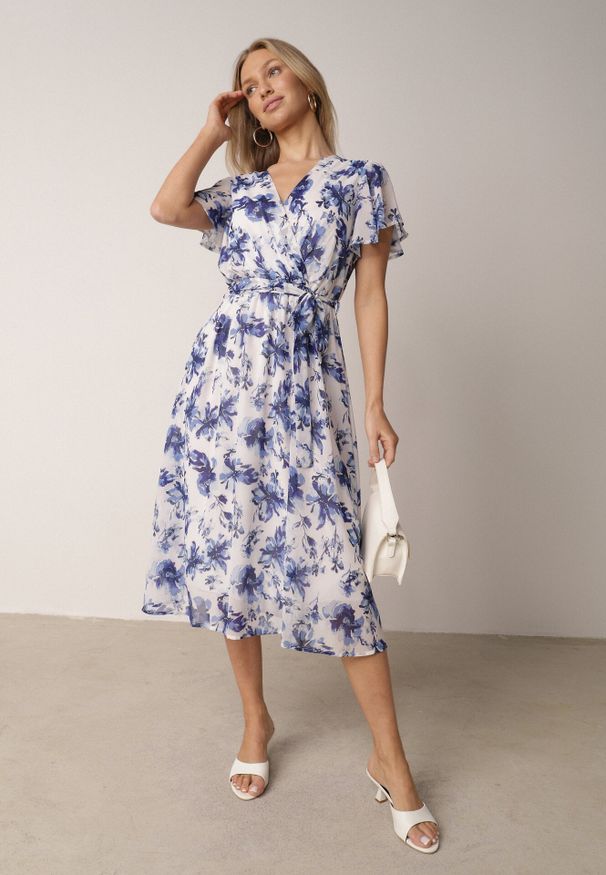 Born2be - Niebieska Kopertowa Sukienka w Kwiaty z Wiązanym Paskiem i Brokatem Hilingea. Okazja: na imprezę, do pracy, na co dzień. Kolor: niebieski. Wzór: kwiaty. Typ sukienki: kopertowe. Styl: casual, elegancki. Długość: midi