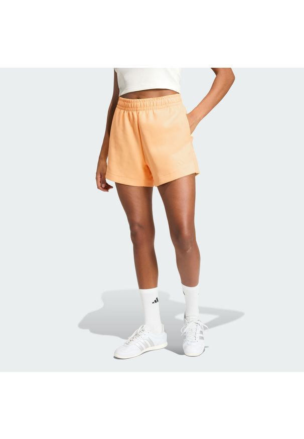 Adidas - Luźne szorty Soft Lux. Kolor: pomarańczowy. Sport: fitness