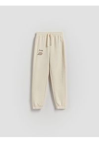 Reserved - Spodnie dresowe Pusheen - beżowy. Kolor: beżowy. Materiał: dresówka #1