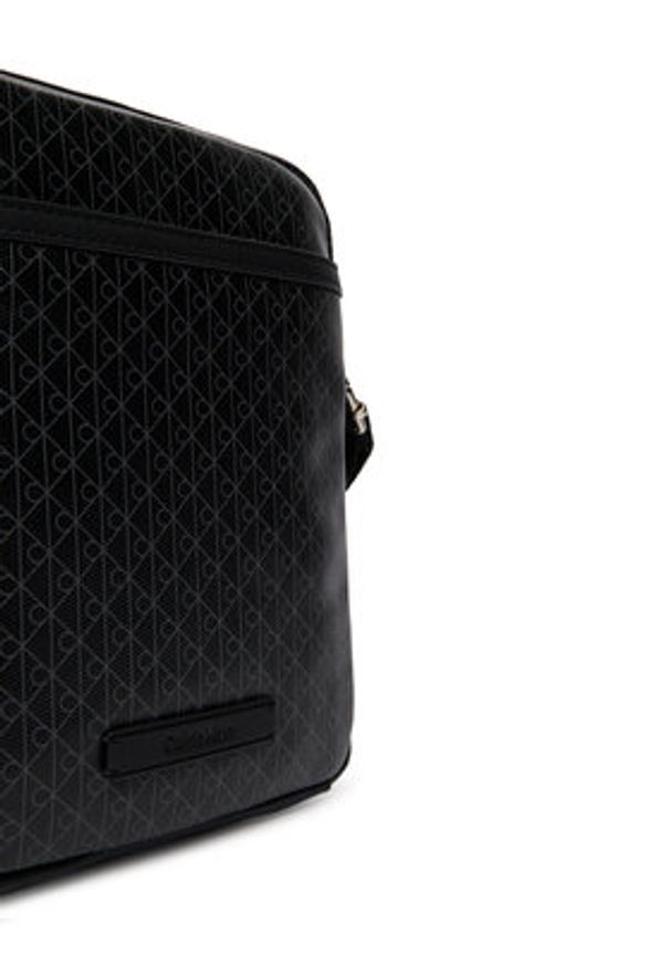 Calvin Klein Saszetka Emblem Aop Coated Slim Reporter LV04D3334G Czarny. Kolor: czarny. Materiał: skóra