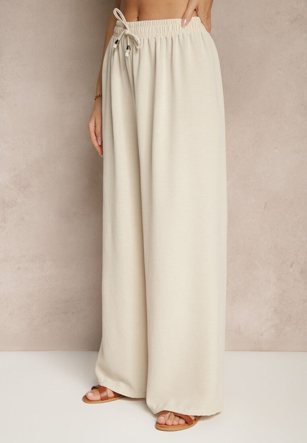 Renee - Jasnobeżowe Spodnie z Bawełną o Szerokim Kroju z Wiązaniem Rosanelisa. Okazja: na co dzień. Stan: podwyższony. Kolor: beżowy. Materiał: bawełna. Styl: casual
