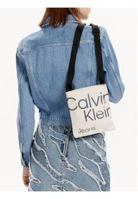 Calvin Klein Jeans Saszetka Sport Essentials Flatpack18 Aop K50K509825 Beżowy. Kolor: beżowy. Materiał: materiał #6