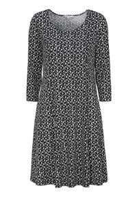 Cellbes Wzorzysta dżersejowa sukienka z bocznymi kieszeniami Czarny biały we wzory female czarny/biały/ze wzorem 62/64. Kolor: biały, czarny, wielokolorowy. Materiał: jersey. Styl: elegancki #1