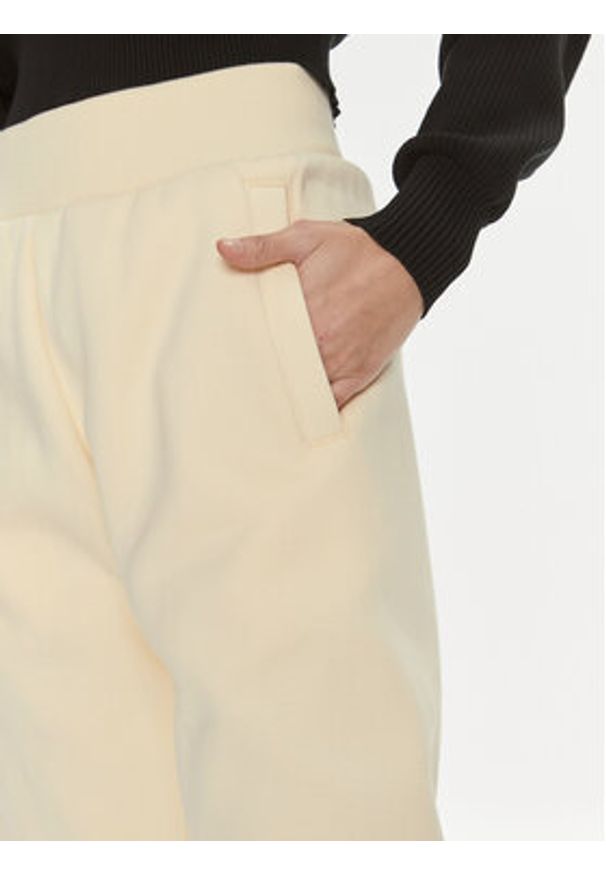 Calvin Klein Jeans Spodnie dresowe Bold Monologo J20J222606 Żółty Relaxed Fit. Kolor: żółty. Materiał: bawełna