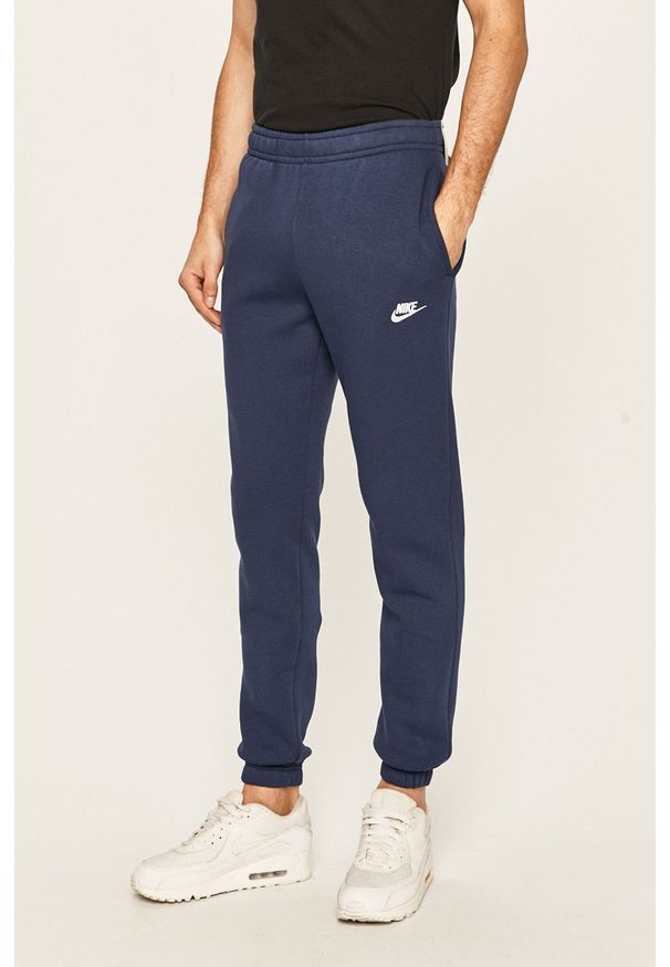 Nike Sportswear - Spodnie. Kolor: niebieski. Materiał: dzianina. Wzór: gładki