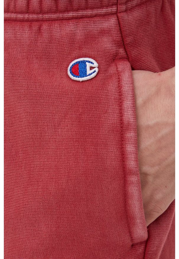 Champion spodnie dresowe męskie kolor różowy gładkie. Kolor: różowy. Materiał: dresówka. Wzór: gładki