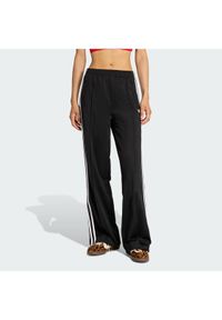 Adidas - adidas Spodnie dresowe Firebird KD7976 Czarny Loose Fit. Kolor: czarny. Materiał: syntetyk #1