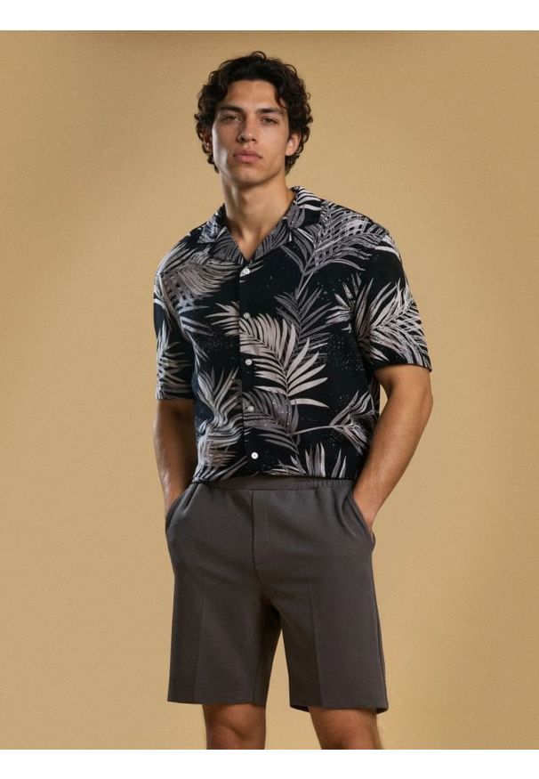 Sinsay - Szorty slim - niebieski. Kolor: niebieski