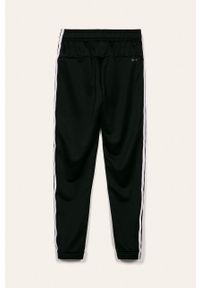 Adidas - adidas - Spodnie dziecięce 128-176 cm. Kolor: czarny. Materiał: tkanina, poliester, dzianina. Wzór: gładki #3